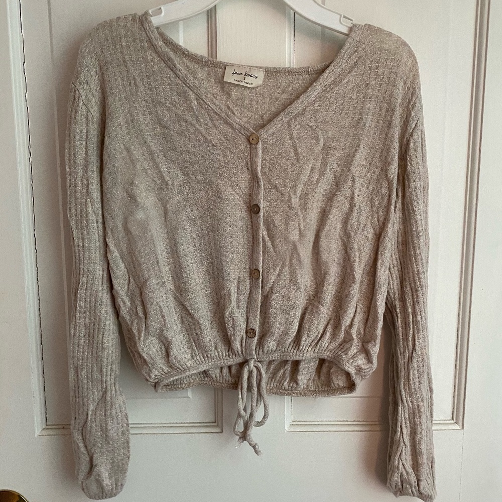 Long sleeve top with tie at bottom